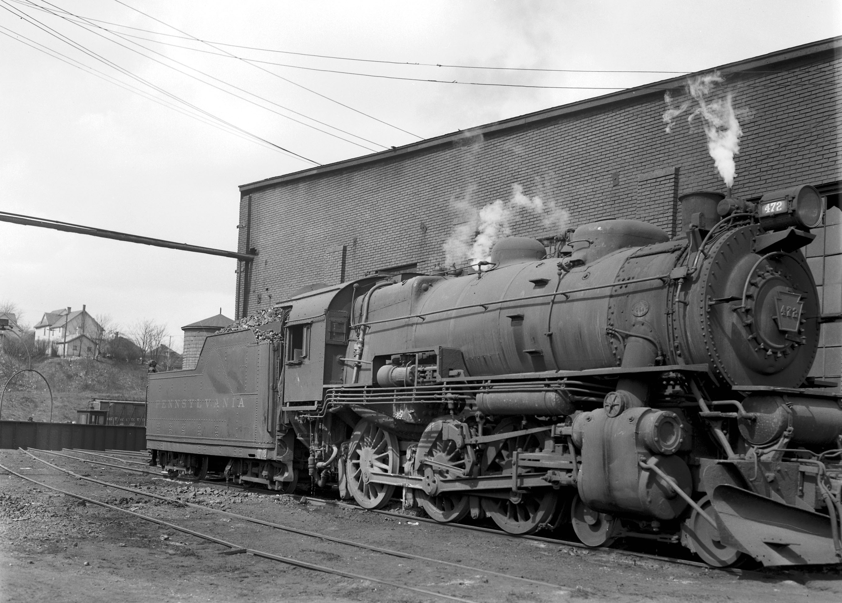 A Pennsylvania Railroad locomotive at rest in a railroad yard in Grand Rapids, Michigan