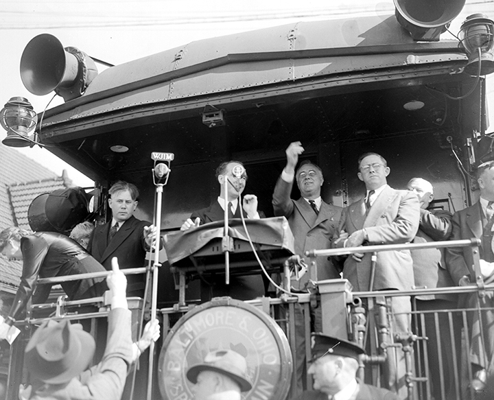 Franklin Delano Roosevelt speaks from the back of a railroad car