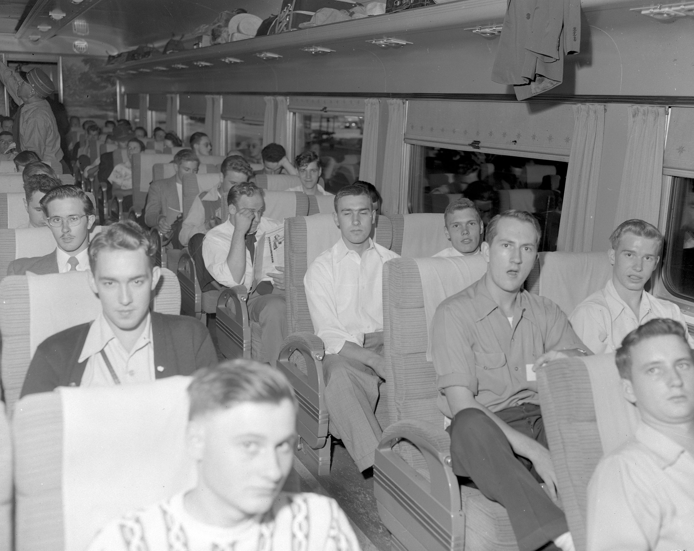 Young men in a passenger railroad car in 1948