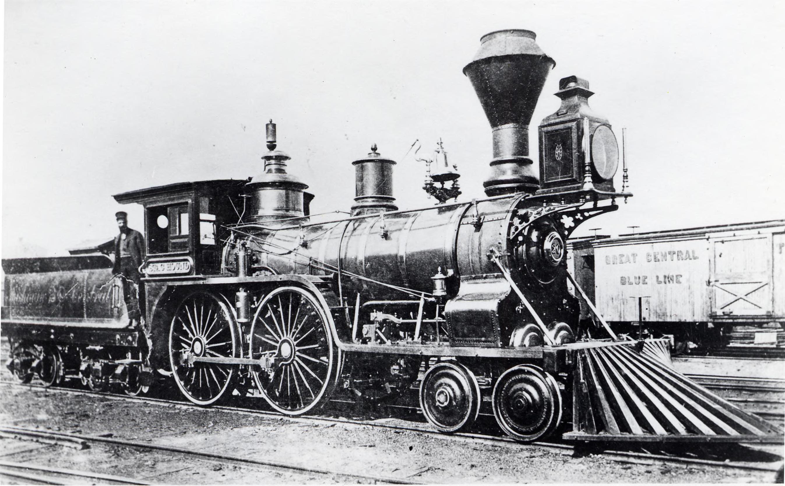 A locomotive rests on a track in a railroad yard