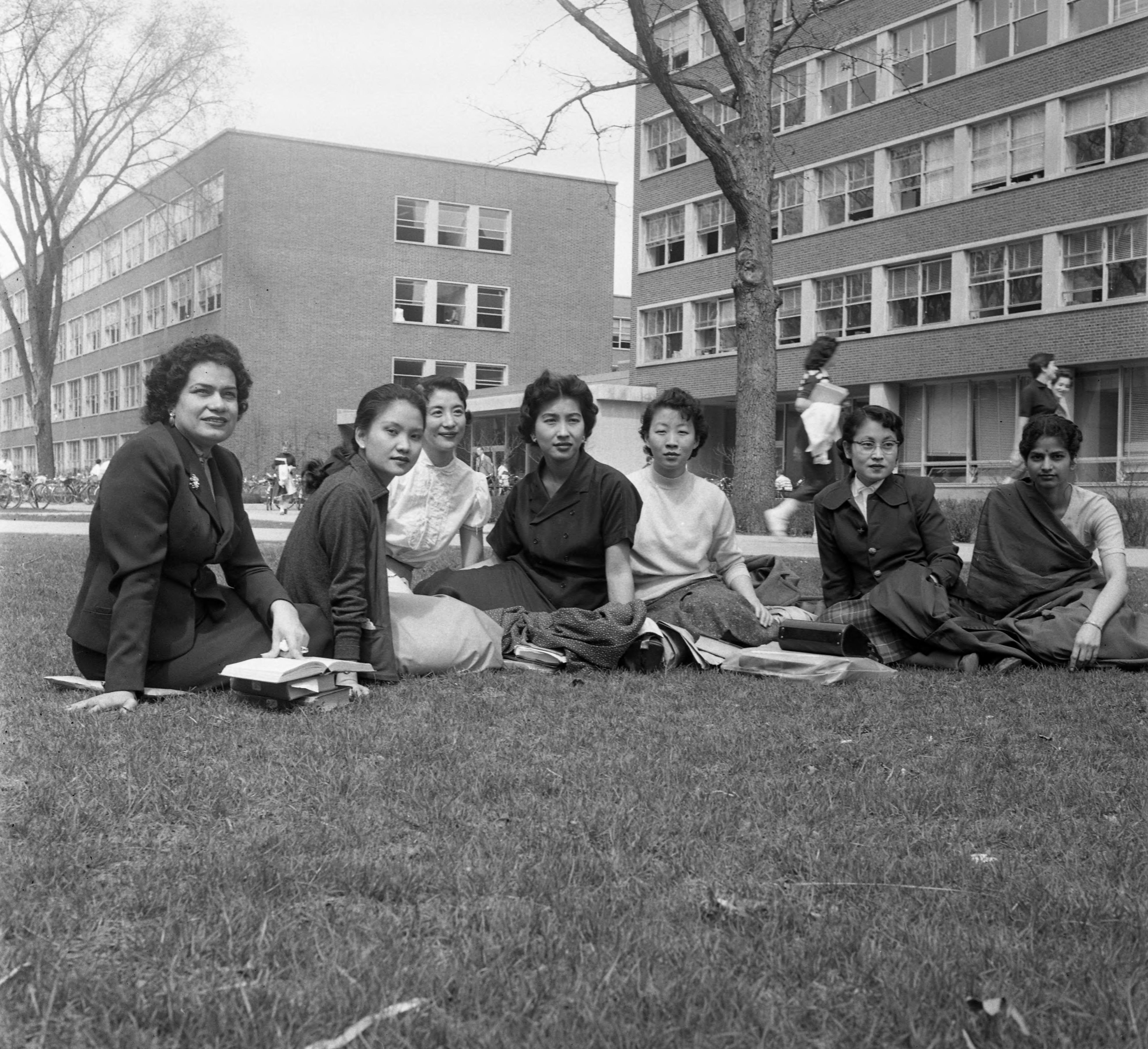 Students sitting on the lawn in front of Haven Hall