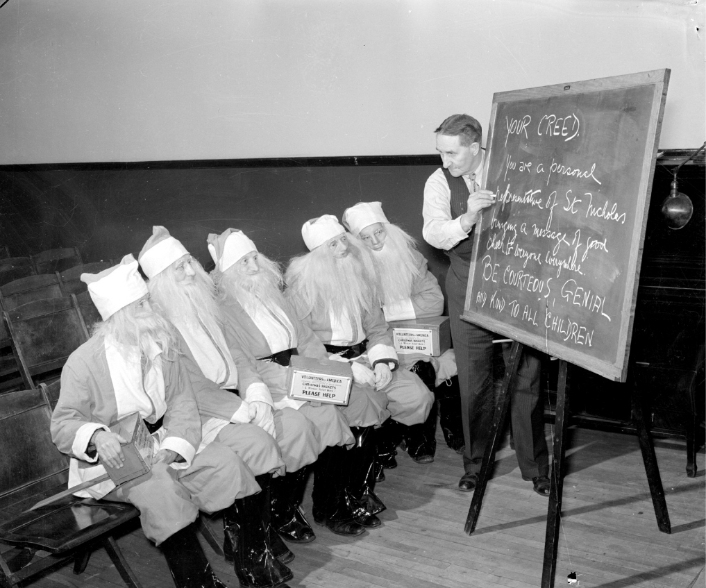 Captain Harry W. Wilson training helpers at the Santa Claus training school