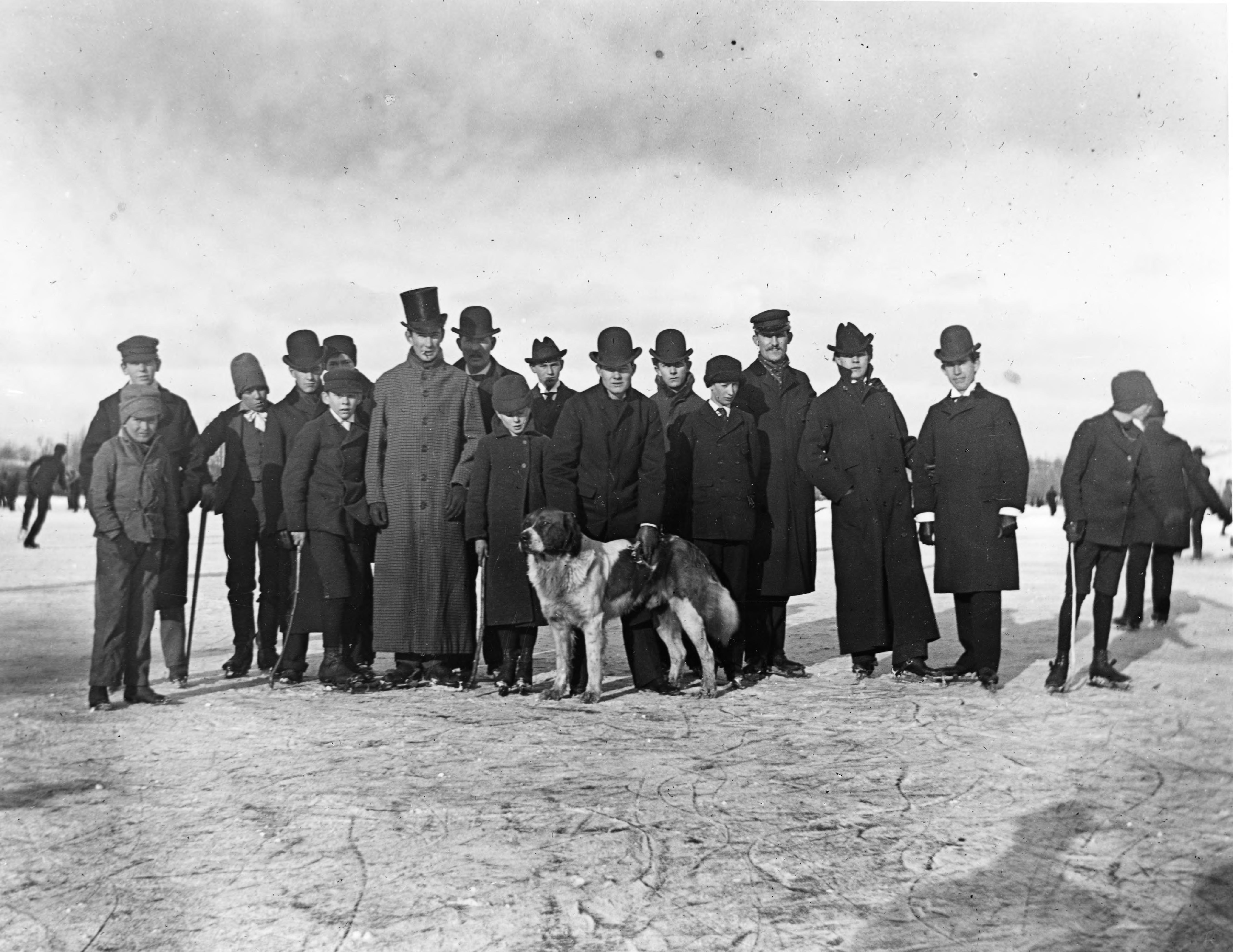 Men at an ice skating party on the Huron River