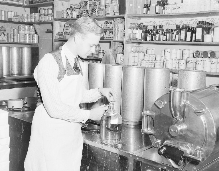 Worker preparing ice cream, 1930s