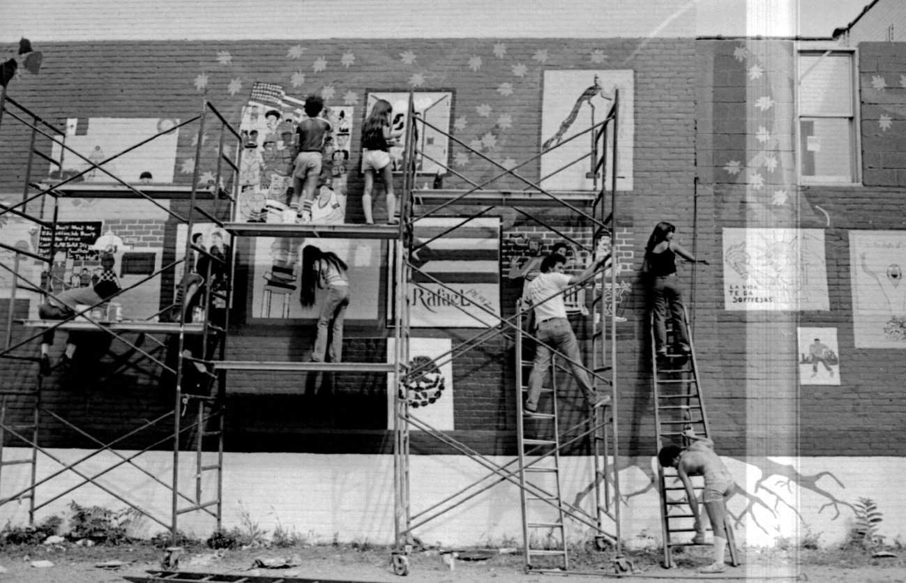 Painters working on a mural