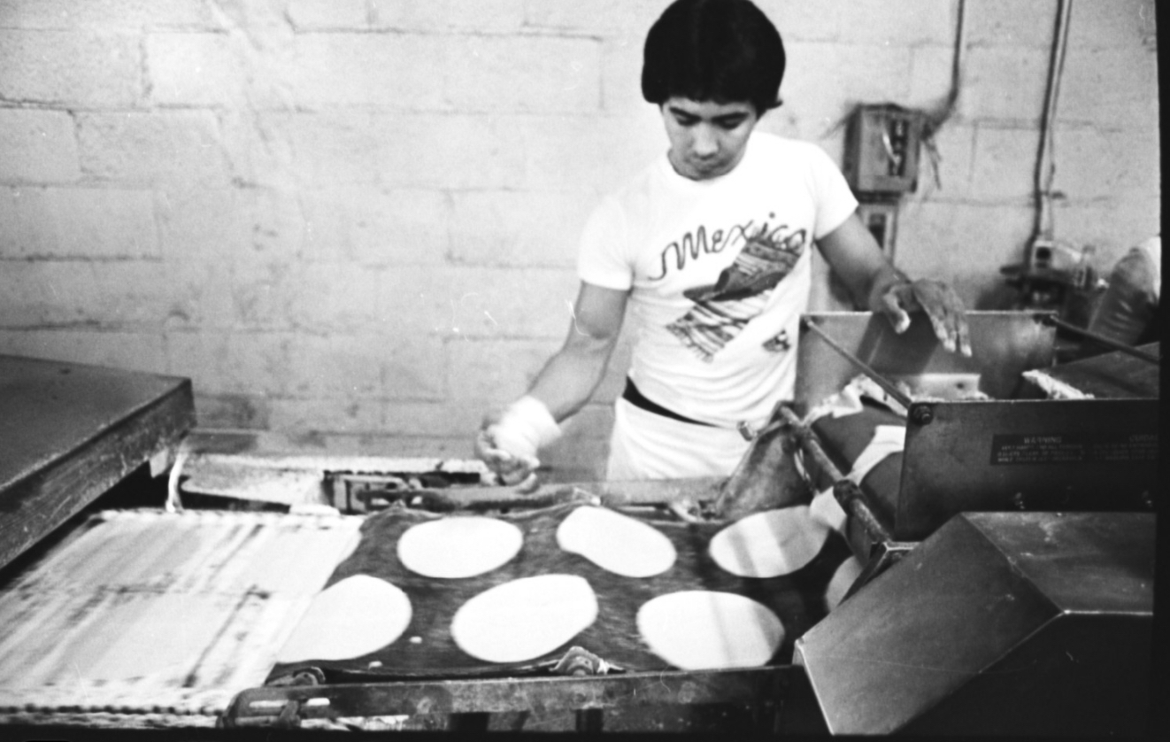 Person cooking tortillas