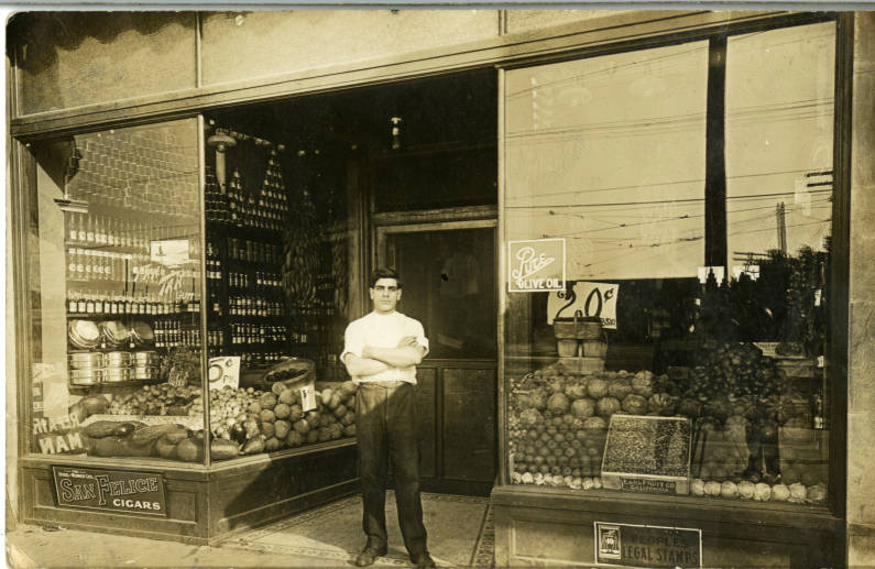 Tefwik Nusser in front of store